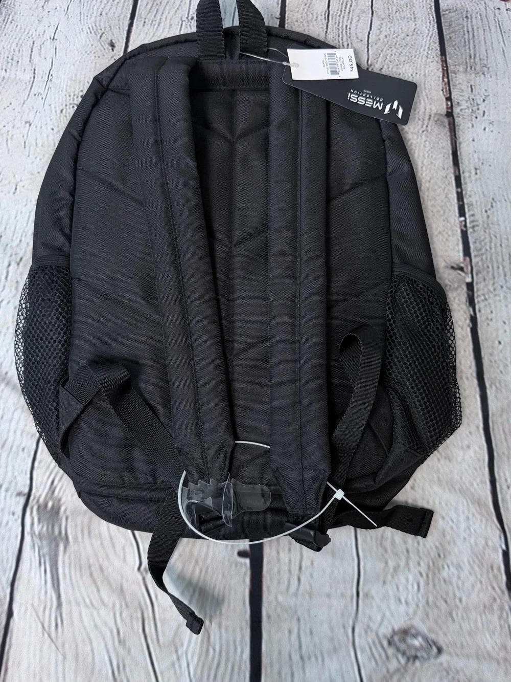 Black Messi backpack with graphic of a soccer player in action